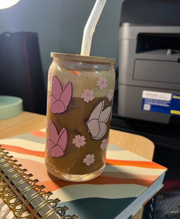 Pink butterflies and flower 16oz glass cup with coffee in it