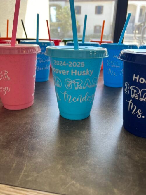 Custom glitter cups in light blue, baby blue, black, and pink