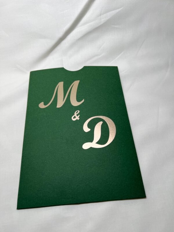 Green pocket envelope with initials