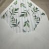 an A7 white envelope with green leaves on it